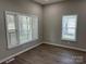 Bright bedroom featuring two windows, providing ample natural light and a cozy atmosphere at 3342 York Hwy, Gastonia, NC 28052
