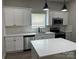 Contemporary kitchen features white cabinets, quartz countertops, stainless appliances, and sleek pendant lighting at 3342 York Hwy, Gastonia, NC 28052