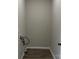 Bright laundry room with utility connections and modern wood-look flooring at 3342 York Hwy, Gastonia, NC 28052