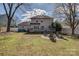 Spacious backyard with a deck, fire pit, and lush lawn at 4107 Balsam St, Indian Trail, NC 28079