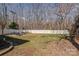 A large backyard with a fire pit, seating, and a white fence at 4107 Balsam St, Indian Trail, NC 28079