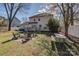 Large backyard featuring a deck, a brick fire pit, and a picnic table at 4107 Balsam St, Indian Trail, NC 28079