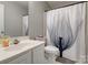 Bathroom featuring a clean white vanity, toilet, and shower curtain at 4107 Balsam St, Indian Trail, NC 28079