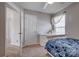 Bright bedroom with a window providing natural light, featuring a white door, dresser and neutral paint at 4107 Balsam St, Indian Trail, NC 28079