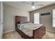 Bedroom with a dark wood bed frame and plenty of storage space underneath at 4107 Balsam St, Indian Trail, NC 28079