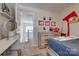 Bedroom showcasing a natural wood dresser, with a view of the staircase at 4107 Balsam St, Indian Trail, NC 28079