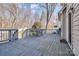 Spacious deck featuring outdoor seating with views of the fenced-in backyard and wooded area at 4107 Balsam St, Indian Trail, NC 28079