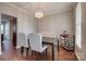 Elegant dining room featuring modern chandelier and sophisticated furnishings at 4107 Balsam St, Indian Trail, NC 28079