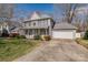Traditional home with a two-car garage and inviting front porch with manicured lawn at 4107 Balsam St, Indian Trail, NC 28079