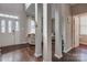 Open foyer with hardwood floors, tall columns, and plenty of natural light at 4107 Balsam St, Indian Trail, NC 28079