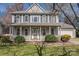 Charming two-story home featuring a covered front porch and well-maintained landscaping at 4107 Balsam St, Indian Trail, NC 28079