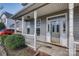 Inviting front porch with white railing and a decorative glass front door at 4107 Balsam St, Indian Trail, NC 28079