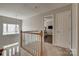 Upstairs hallway with bedroom entrance and lots of natural light at 4107 Balsam St, Indian Trail, NC 28079