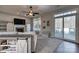 Cozy living room with a fireplace, TV, built-in shelving, and access to the deck at 4107 Balsam St, Indian Trail, NC 28079