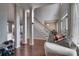 Open-concept living area with hardwood floors, tall columns, and natural light at 4107 Balsam St, Indian Trail, NC 28079