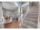 Spacious living room showcasing hardwood floors, stairs, and bright natural light at 4107 Balsam St, Indian Trail, NC 28079