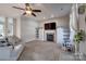 Cozy living room featuring a fireplace, ceiling fan, and comfortable seating at 4107 Balsam St, Indian Trail, NC 28079