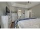 Main bedroom featuring a tray ceiling, dresser, and wood floors at 4107 Balsam St, Indian Trail, NC 28079