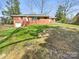 Large backyard and detached garage space offer ample outdoor potential at 414 N Wylie St, Lancaster, SC 29720
