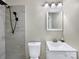 Bathroom with tile surround shower, sleek vanity, updated fixtures and lighting at 414 N Wylie St, Lancaster, SC 29720