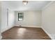 Bedroom featuring hardwood floors, a built-in wardrobe, and natural light at 414 N Wylie St, Lancaster, SC 29720