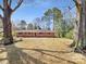 Charming single-story brick home with a well-maintained front lawn and mature trees at 414 N Wylie St, Lancaster, SC 29720