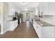 Bright kitchen featuring white cabinets, stainless steel appliances and granite countertops at 414 N Wylie St, Lancaster, SC 29720
