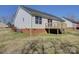 Home exterior featuring a brick foundation, white siding, and a wood deck at 439 Berwick Dr, Rock Hill, SC 29730