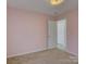 Light pink bedroom with neutral carpet and white trim at 439 Berwick Dr, Rock Hill, SC 29730