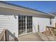 Exterior shot of sliding glass door leading onto a wooden deck with white vinyl siding at 439 Berwick Dr, Rock Hill, SC 29730
