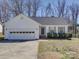Charming single story home featuring an attached two car garage and well-maintained landscaping at 439 Berwick Dr, Rock Hill, SC 29730
