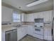 Sunlit kitchen showcasing white cabinetry, stainless steel appliances, and modern countertops at 439 Berwick Dr, Rock Hill, SC 29730
