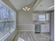 Bright kitchen featuring updated appliances, modern flooring, and an adjacent dining area with great natural light at 439 Berwick Dr, Rock Hill, SC 29730