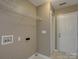 Laundry room featuring neutral walls, vinyl flooring, and an exterior door at 439 Berwick Dr, Rock Hill, SC 29730