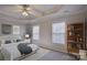 Spacious main bedroom featuring a tray ceiling, neutral walls, and carpeted floors at 439 Berwick Dr, Rock Hill, SC 29730