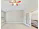 Bright bonus room with a ceiling fan, carpet flooring, a window, and a door to the second floor at 4624 Pebble Run Dr, Matthews, NC 28105