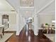 Spacious foyer with hardwood floors, staircase and architectural details at 4624 Pebble Run Dr, Matthews, NC 28105