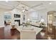 Cozy living room with fireplace, coffered ceiling, and hardwood floors at 4624 Pebble Run Dr, Matthews, NC 28105