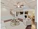 Open living room featuring coffered ceiling, hardwood floors, and access to the kitchen at 4624 Pebble Run Dr, Matthews, NC 28105