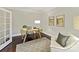 Bright and airy office with wood floors, neutral walls, and modern desk at 4624 Pebble Run Dr, Matthews, NC 28105