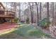 Backyard view showing putting green, patio, and fireplace at 4763 River Hills Dr, Denver, NC 28037