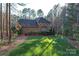 Expansive backyard featuring a lush lawn and mature trees, perfect for outdoor activities at 4763 River Hills Dr, Denver, NC 28037