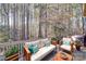 Comfortable deck featuring stylish outdoor furniture and lush greenery at 4763 River Hills Dr, Denver, NC 28037
