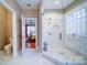 Bright bathroom featuring a glass shower with white subway tile and a hexagon tile floor at 4763 River Hills Dr, Denver, NC 28037