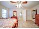 Bright bedroom with a bed, carpet flooring, and two closets at 4763 River Hills Dr, Denver, NC 28037