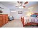 Cozy bedroom with a ceiling fan, natural light, and carpet flooring at 4763 River Hills Dr, Denver, NC 28037