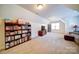 Large bonus room with carpet, a TV, and plenty of space for activities at 4763 River Hills Dr, Denver, NC 28037