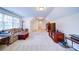 Comfortable bonus room with carpet, a couch, and a television for entertainment at 4763 River Hills Dr, Denver, NC 28037