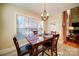 Inviting dining area with large windows and easy access to living room at 4763 River Hills Dr, Denver, NC 28037