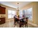Cozy dining area features bright windows and stylish light fixture at 4763 River Hills Dr, Denver, NC 28037